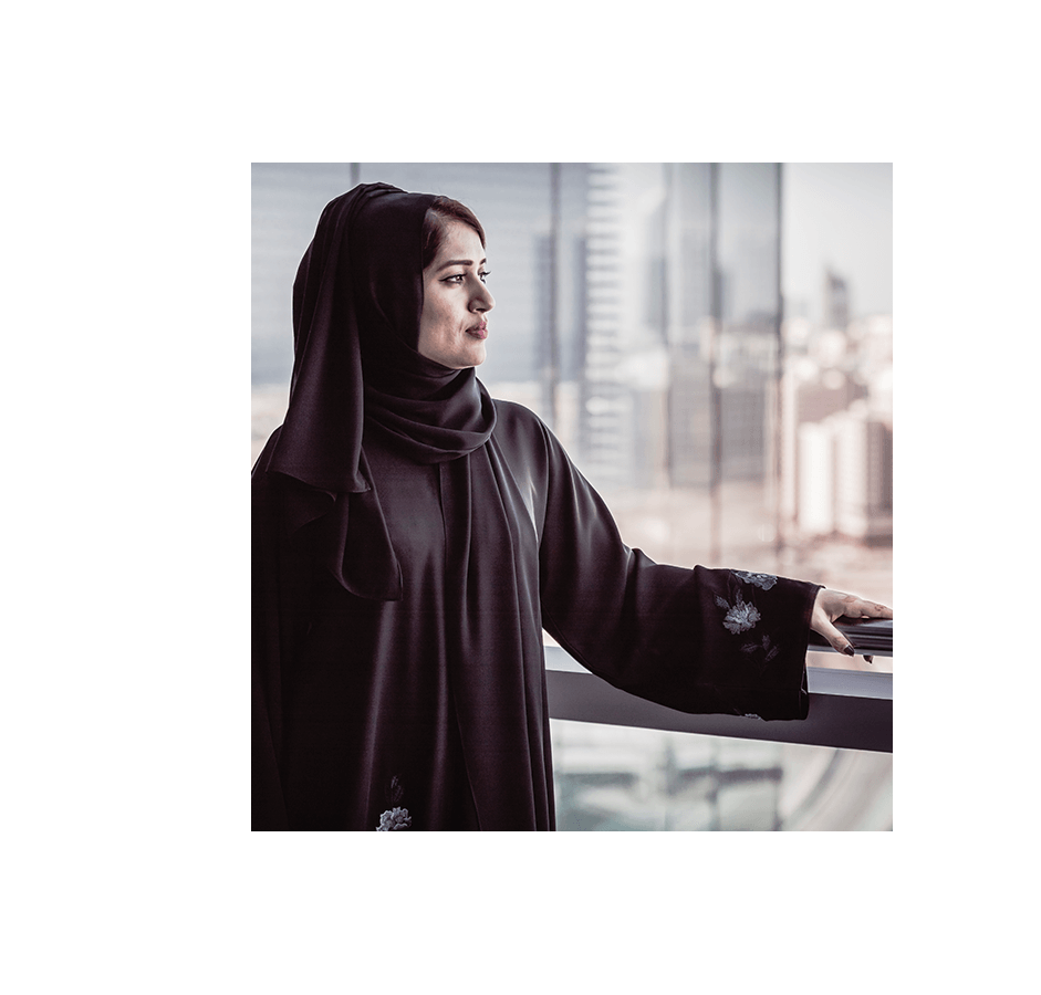 a woman standing at window